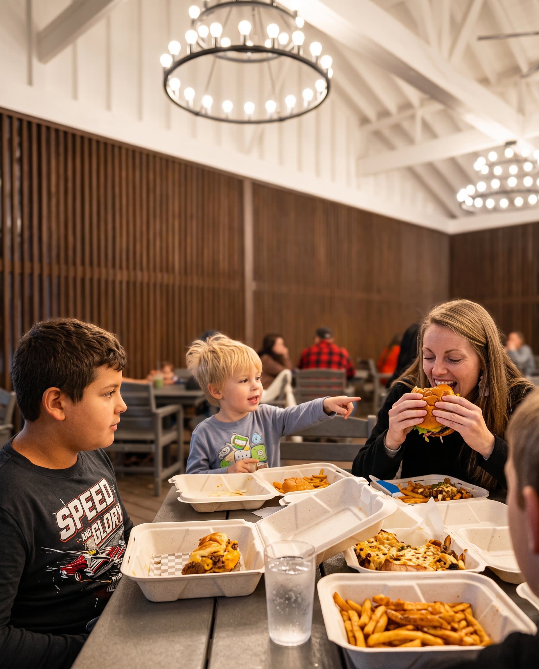 Cheeseburgers and fries on an indoor table