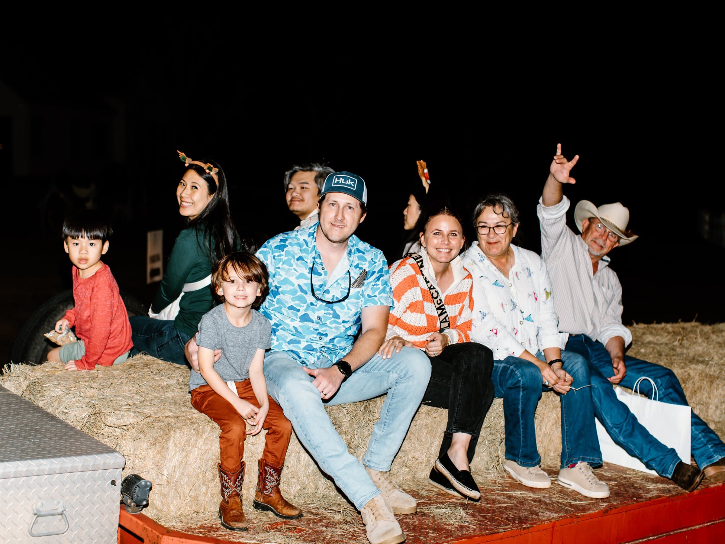 Guests riding together on a Christmas hayride