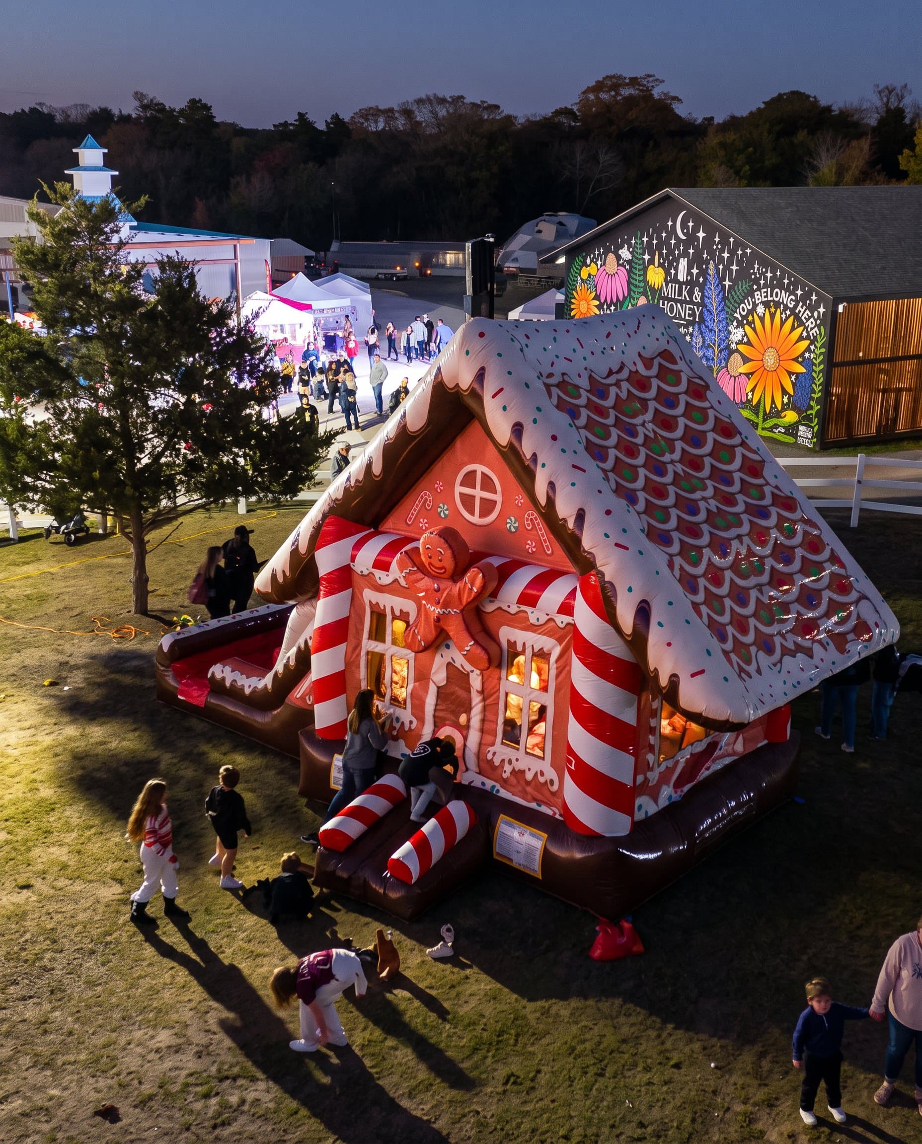 A gingerbread bounce house with a smiling face
